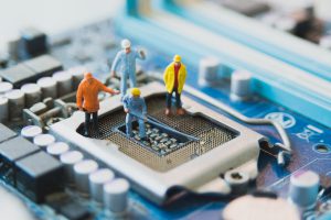 Miniature People Network Engineers At Mainborad Computer